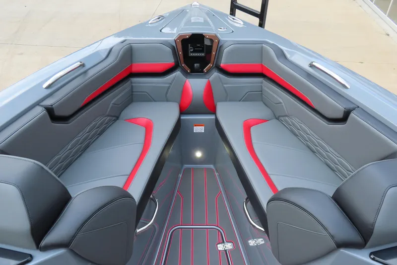 Slide: The Image of 2025 Sunsation 32CCX boat interior with sleek gray and red seating design. - 20