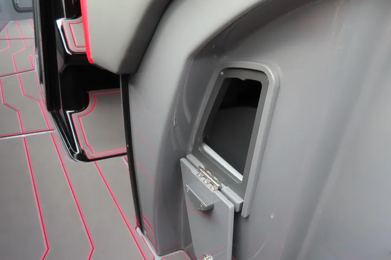 Slide: The Image of 2025 Sunsation 32CCX boat interior with sleek gray and red design details. - 22