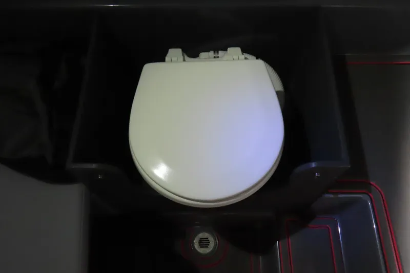 Slide: The Image of 2025 Sunsation 32CCX boat interior with a compact toilet setup. - 23