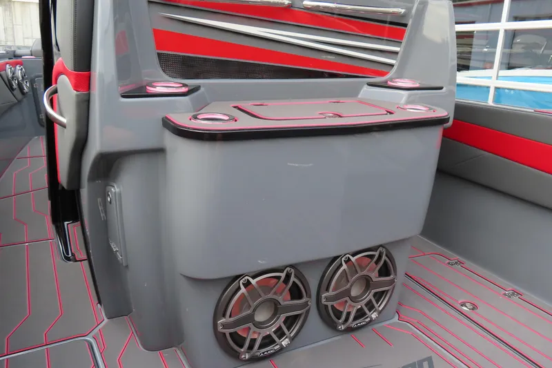 Slide: The Image of 2025 Sunsation 32CCX boat interior with sleek design, featuring speakers and cup holders. - 24