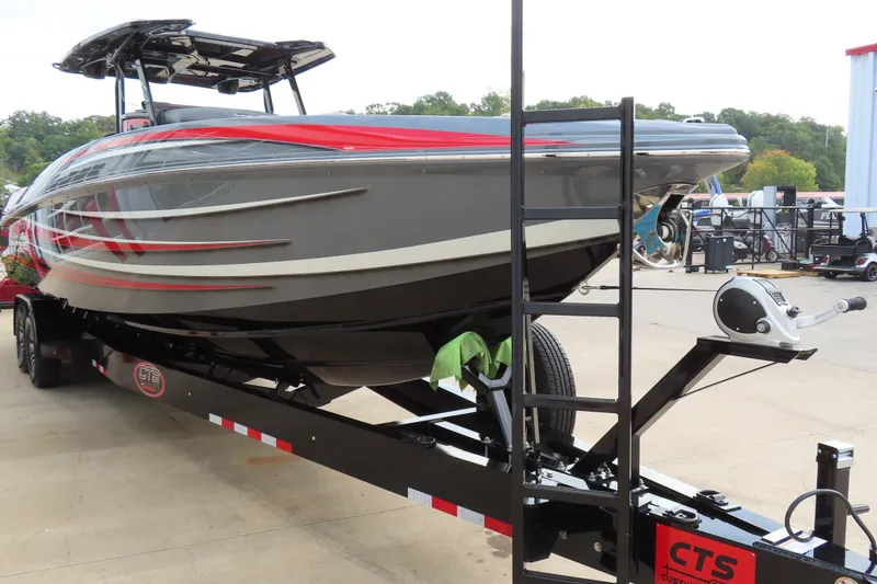 Slide: The Image of 2025 Sunsation 32CCX boat on trailer, featuring sleek design and vibrant red accents. - 8