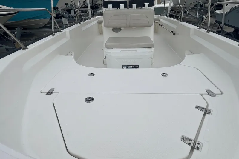 Slide: The Image of 2022 Boston Whaler 170 Montauk boat interior with seating and storage compartments. - 11