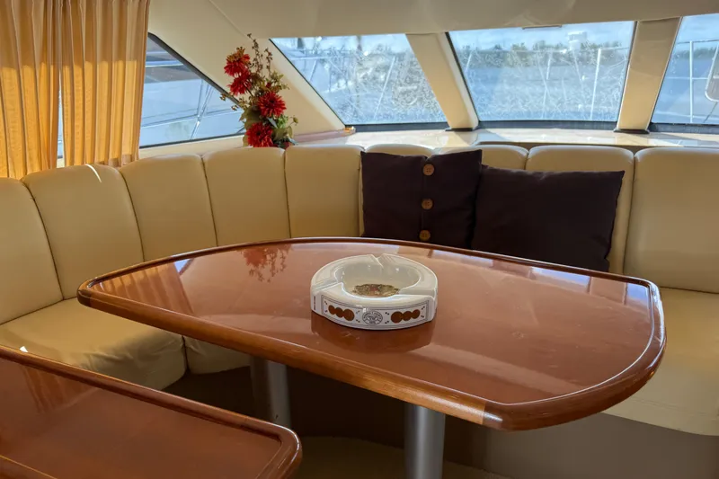 Slide: The Image of Interior of 2003 Carver 360 Sport Sedan with elegant seating and table. - 13