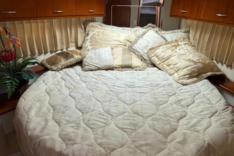 Slide: The Image of Luxurious bedroom interior of 2003 Carver 360 Sport Sedan with elegant bedding and decor. - 15