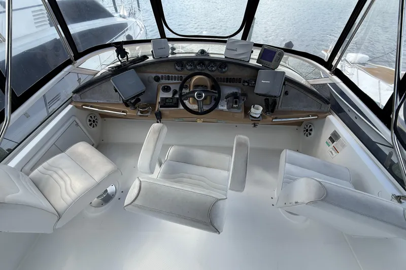 Slide: The Image of 2003 Carver 360 Sport Sedan helm with white seating and navigation equipment. - 7