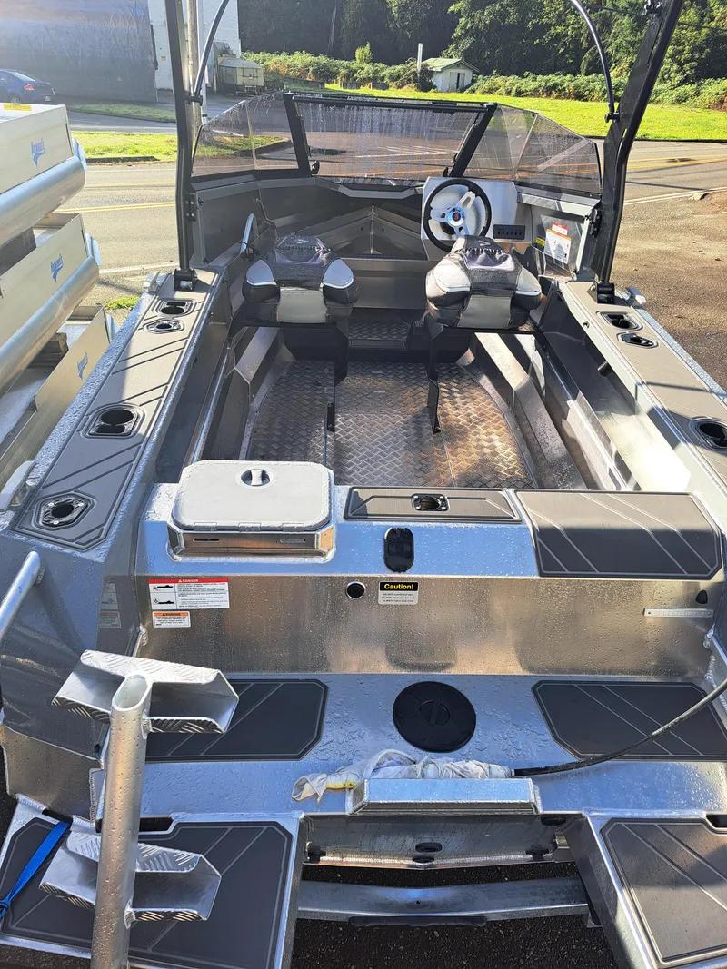 Slide: The Image of 2024 Stabicraft 1550 Fisher boat interior with dual seats and steering wheel. - 3