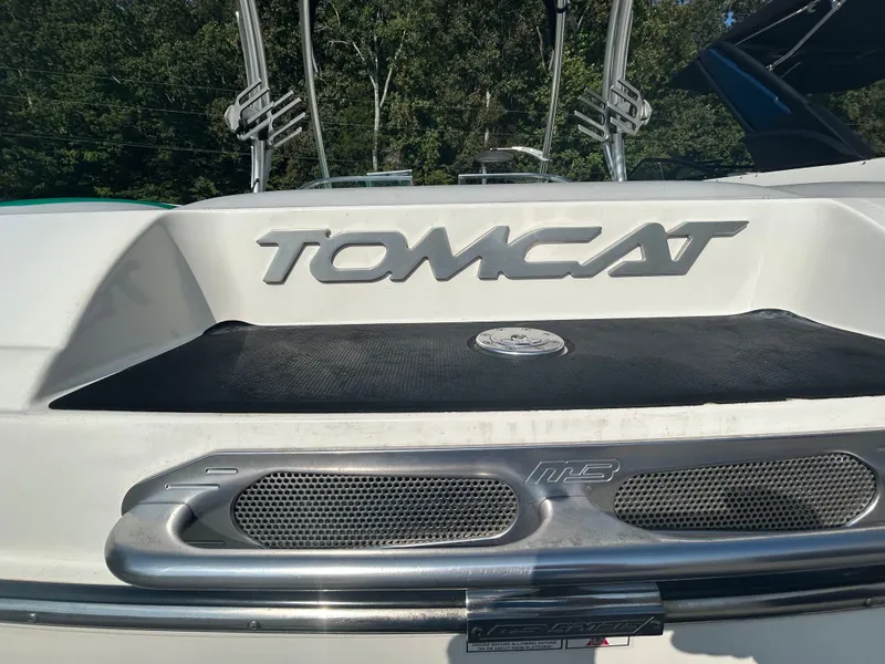 Slide: The Image of 2011 MB SPORTS 21 Tomcat boat rear view with logo and swim platform. - 2