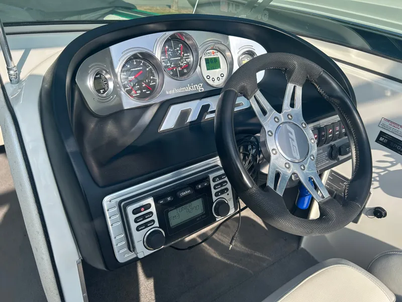 Slide: The Image of Dashboard of 2011 MB SPORTS 21 Tomcat boat with steering wheel and gauges. - 6