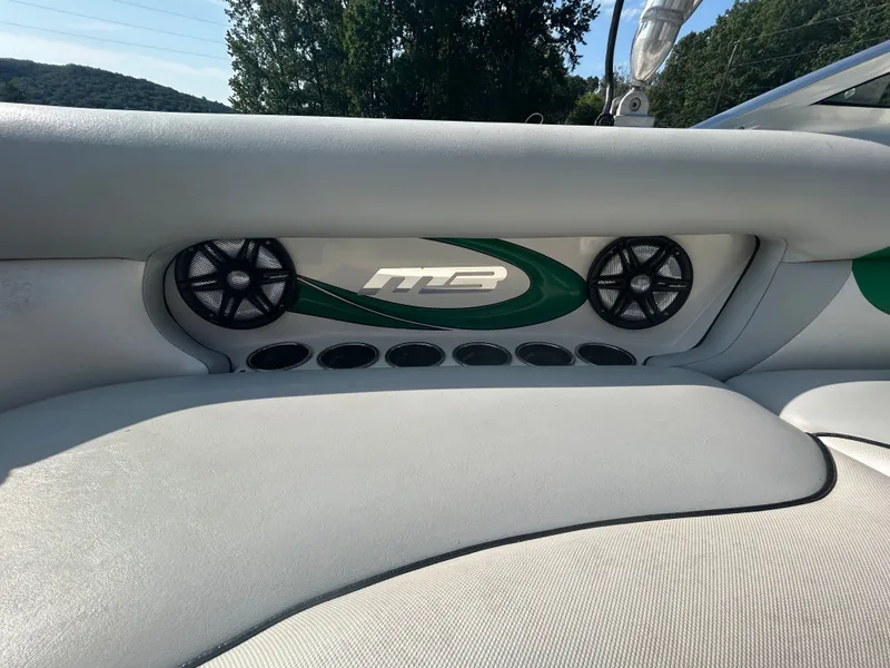 Slide: The Image of Interior of 2011 MB Sports 21 Tomcat boat with speakers and logo detail. - 8