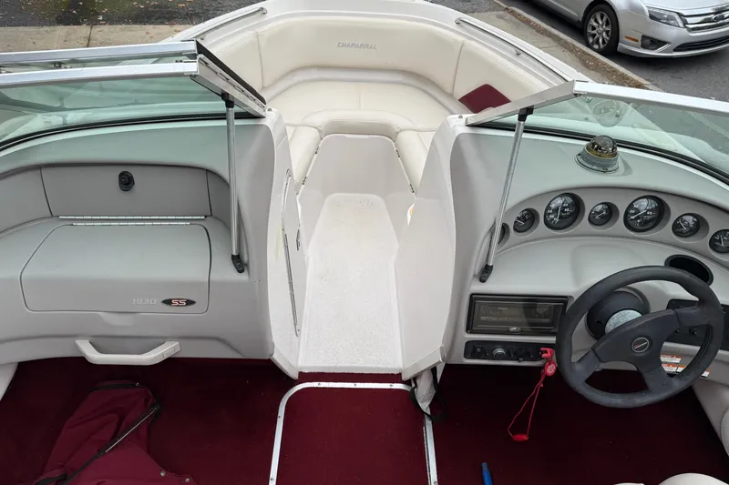 Slide: The Image of Interior of a 1999 Chaparral 1930 SS boat with dashboard and seating area. - 5