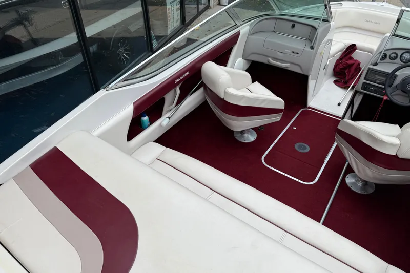 Slide: The Image of Interior of a 1999 Chaparral 1930 SS boat with maroon and white seating. - 7