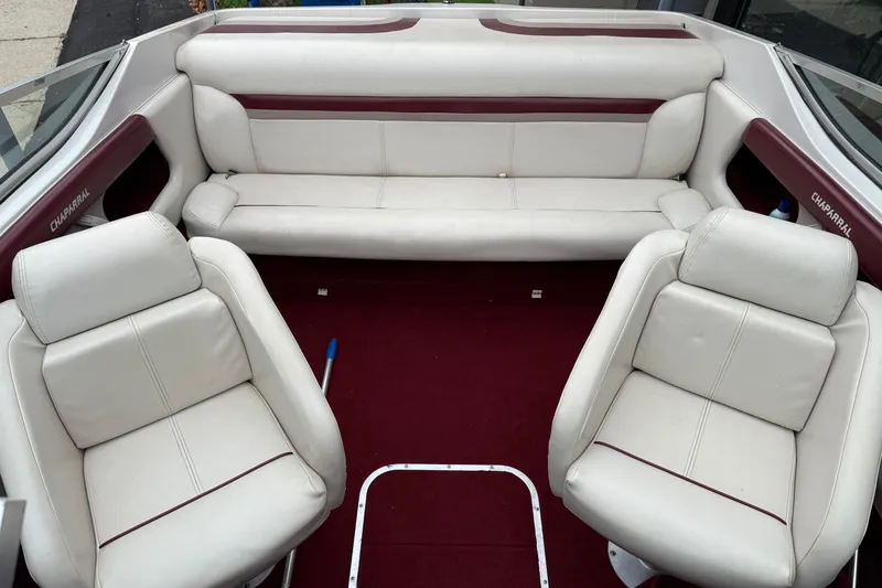 Slide: The Image of Interior of a 1999 Chaparral 1930 SS boat with white and maroon seating. - 9