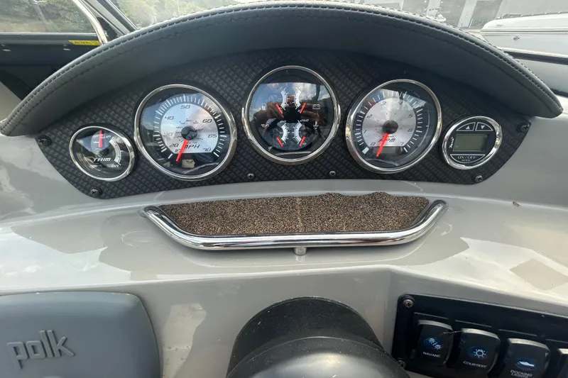 Slide: The Image of Dashboard of a 2017 Stingray 235 LR boat with gauges and controls. - 6