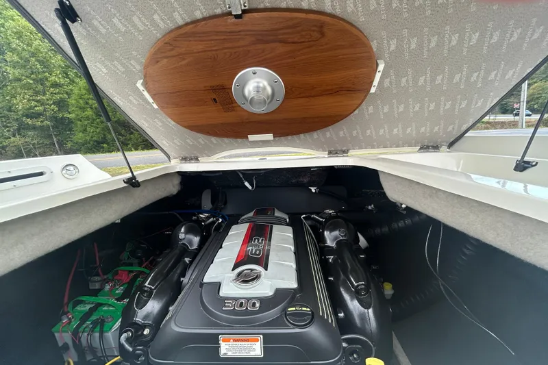 Slide: The Image of 2017 Stingray 235 LR boat engine compartment with 6.2L 300 horsepower engine. - 9