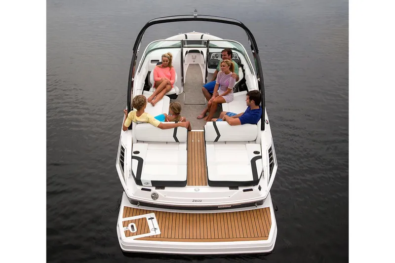 Slide: The Image of 2018 Regal 2500 Bowrider boat in a showroom, rear view with seating and deck. - 2
