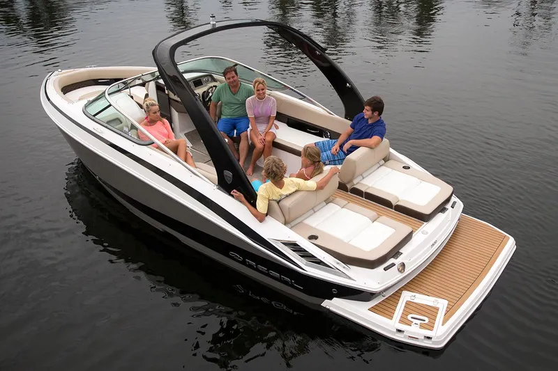 Slide: The Image of Manufacturer Provided Image: 2018 Regal 2500 Bowrider boat with passengers on a calm lake. - 22