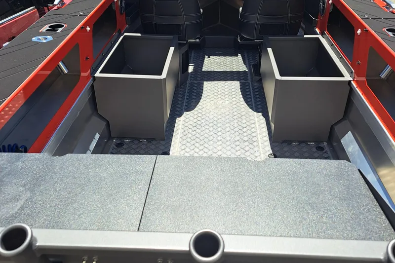 Slide: The Image of 2024 Stabicraft Treker Profish interior with storage compartments and seating. - 10