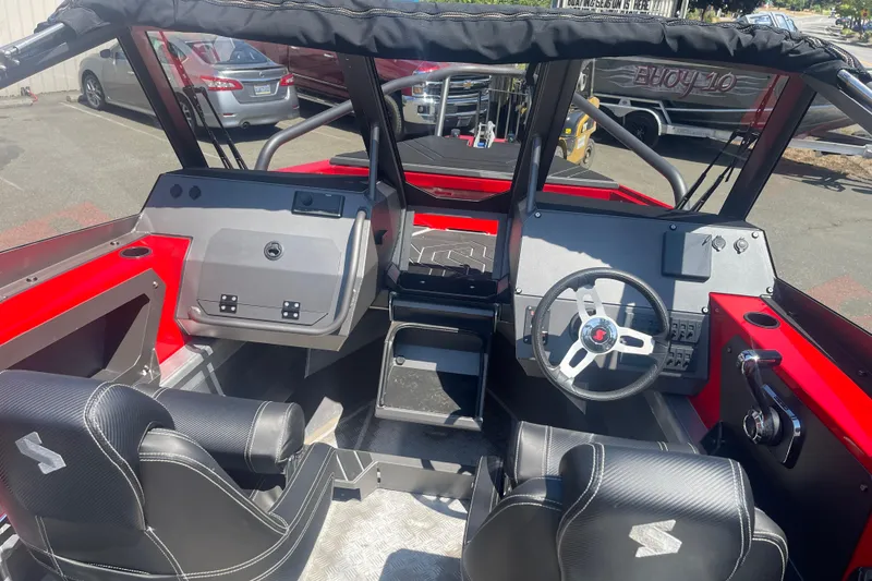 Slide: The Image of 2024 Stabicraft Treker Profish boat interior with modern dashboard and seating. - 13