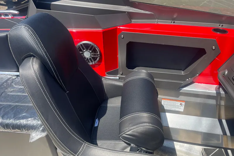 Slide: The Image of 2024 Stabicraft Treker Profish interior with black seat and red dashboard detail. - 14