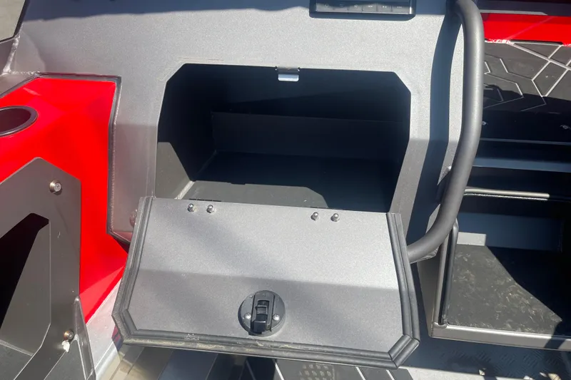 Slide: The Image of 2024 Stabicraft Treker Profish storage compartment with open hatch, featuring sleek design. - 18