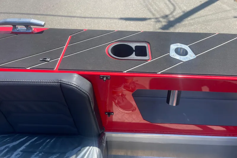 Slide: The Image of 2024 Stabicraft Treker Profish boat interior with red accents and cup holder. - 7