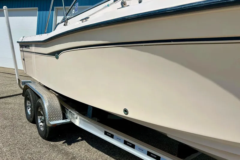 Slide: The Image of 2006 Grady White 225 Dual Console boat on trailer, side view. - 12