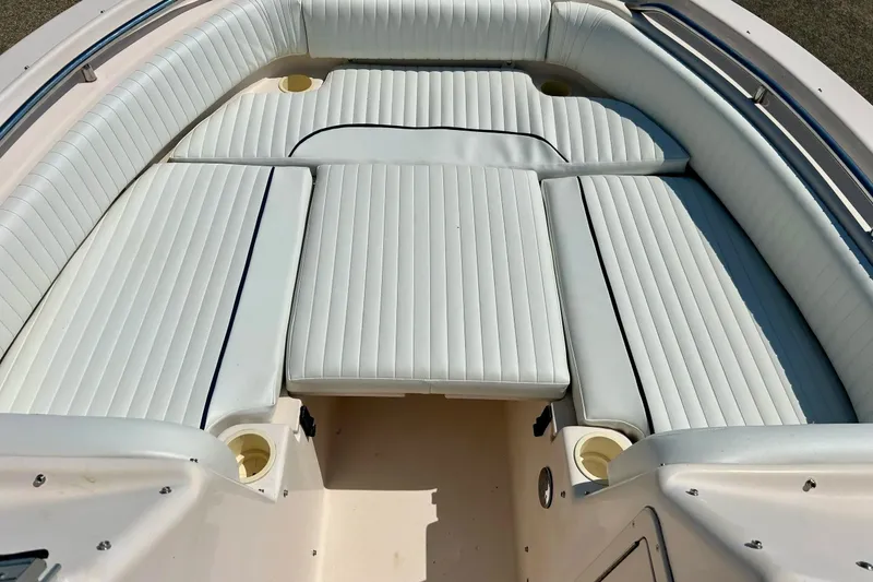 Slide: The Image of 2006 Grady White 225 Dual Console boat interior with cushioned seating. - 13