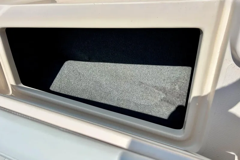 Slide: The Image of Storage compartment on a 2006 Grady White 225 Dual Console boat. - 15