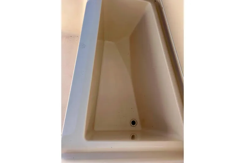 Slide: The Image of Storage compartment of 2006 Grady White 225 Dual Console boat. - 17