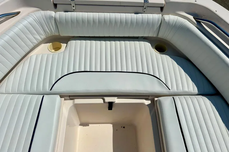 Slide: The Image of 2006 Grady White 225 Dual Console boat interior with white cushioned seating. - 18