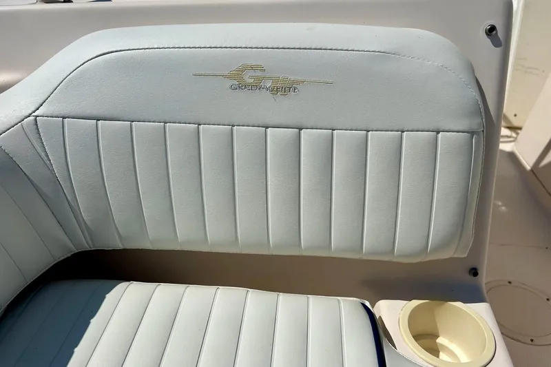 Slide: The Image of Grady White 225 Dual Console 2006 boat seat with logo and cup holder. - 22