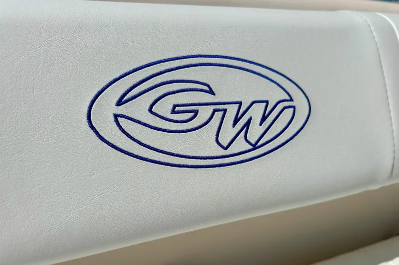 Slide: The Image of Grady White 225 Dual Console 2006 logo on white upholstery. - 25
