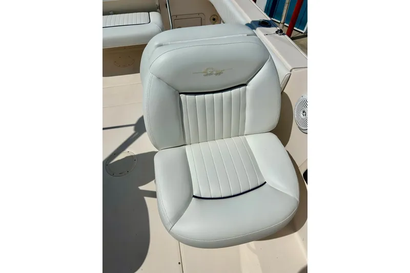 Slide: The Image of White seat on 2006 Grady White 225 Dual Console boat, featuring sleek design and comfort. - 27