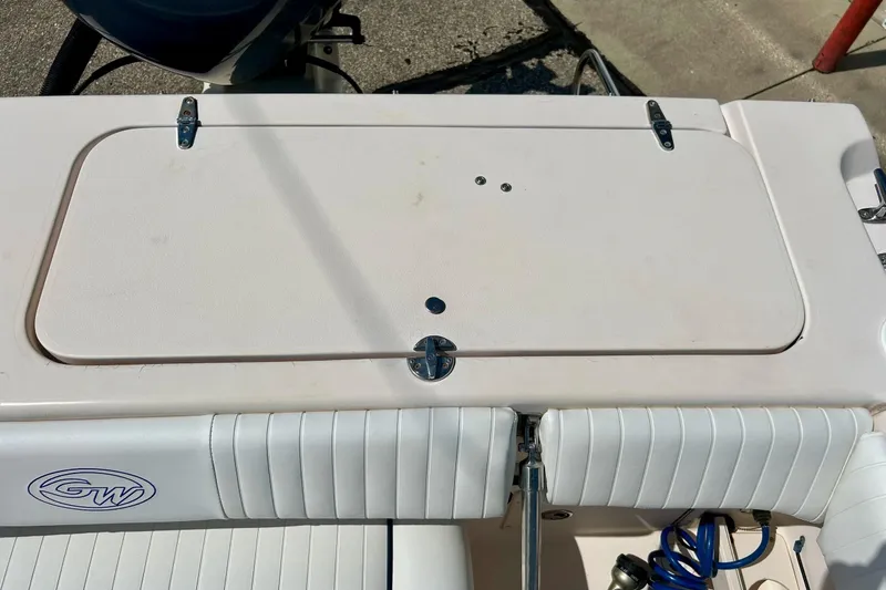 Slide: The Image of 2006 Grady-White Tournament 225 boat deck with storage compartment and seating. - 31