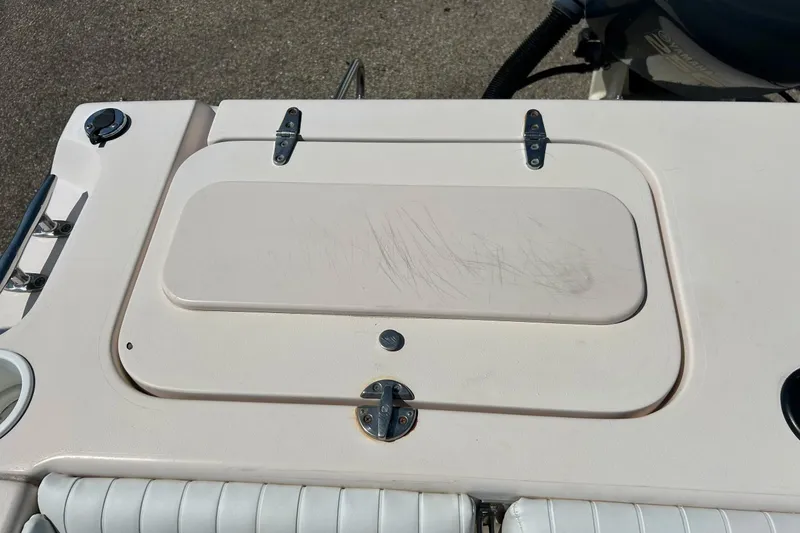 Slide: The Image of 2006 Grady White 225 Dual Console boat hatch with visible scratches. - 33