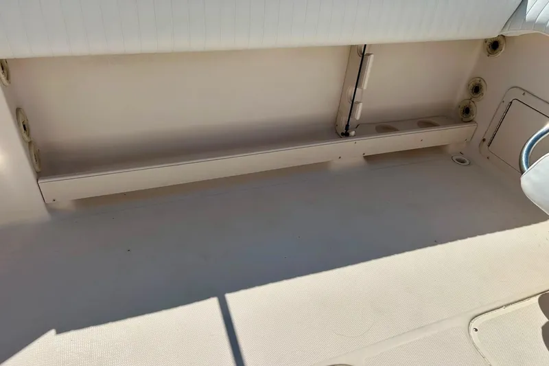Slide: The Image of 2006 Grady White 225 Dual Console boat interior, featuring spacious storage area. - 40