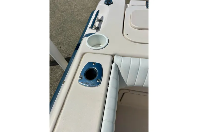 Slide: The Image of 2006 Grady White 225 Dual Console boat interior with cup holder and seating. - 44