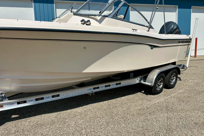 Slide: The Image of 2006 Grady White 225 Dual Console boat on Venture trailer, parked outdoors. - 47