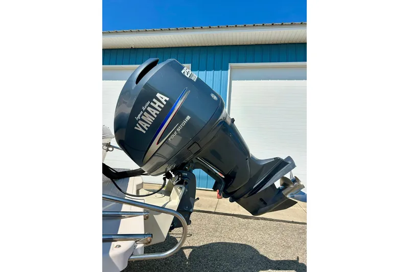 Slide: The Image of Yamaha outboard motor on a 2006 Grady White 225 Dual Console boat. - 49