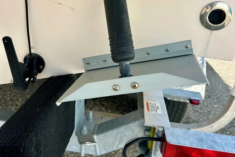 Slide: The Image of 2006 Grady White 225 Dual Console boat trailer detail with trim tab and wiring. - 52