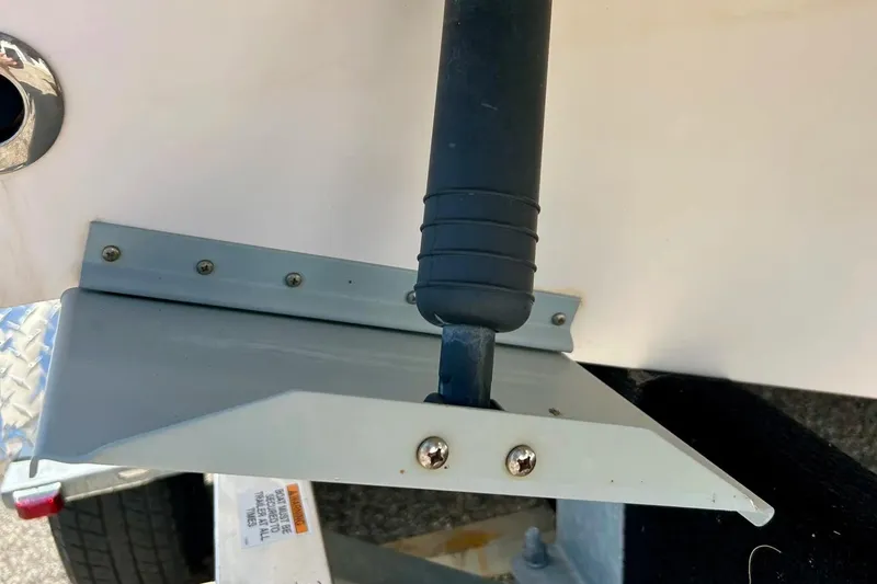 Slide: The Image of Trim tab of 2006 Grady White 225 Dual Console boat, close-up view. - 53