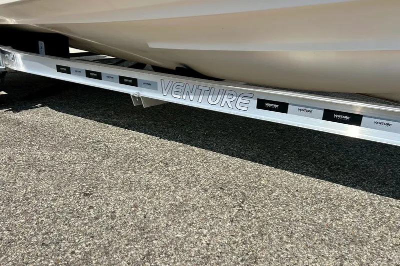 Slide: The Image of Trailer for 2006 Grady White 225 Dual Console boat on pavement. - 9