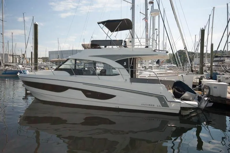 Slide: The Image of 2024 Beneteau Antares 11 Fly cockpit with seating and ladder, showcasing modern design. - 1
