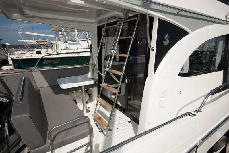 Slide: The Image of Luxurious cabin interior of 2024 Beneteau Antares 11 Fly with blue bedding and pillows. - 4