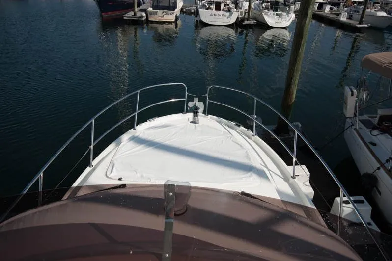 Slide: The Image of 2024 Beneteau Antares 11 Fly yacht docked at marina under clear blue sky. - 6
