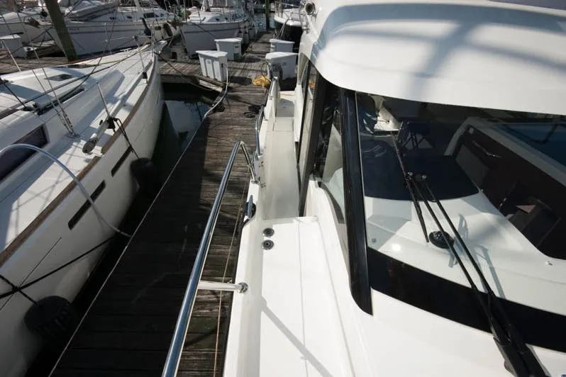 Slide: The Image of Twin Mercury outboard engines on a 2024 Beneteau Antares 11 Fly at dockside. - 7