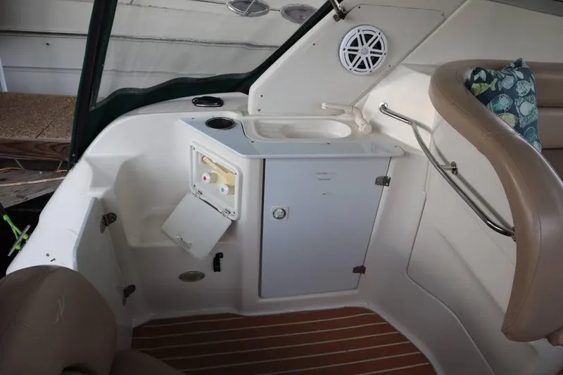 Slide: The Image of Interior of 2002 Regal Commodore 2860 boat with sink and seating area. - 6