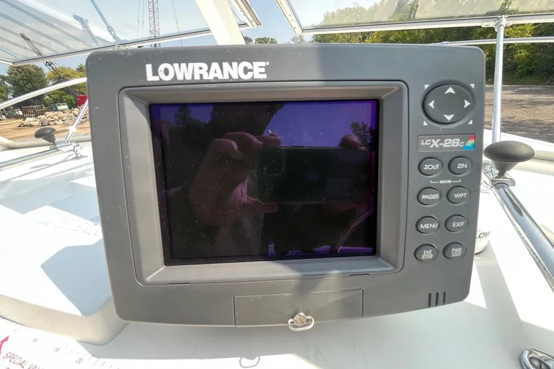 Slide: The Image of Lowrance LCX-28c GPS unit on a 1975 Bertram 26 Moppie boat dashboard. - 15