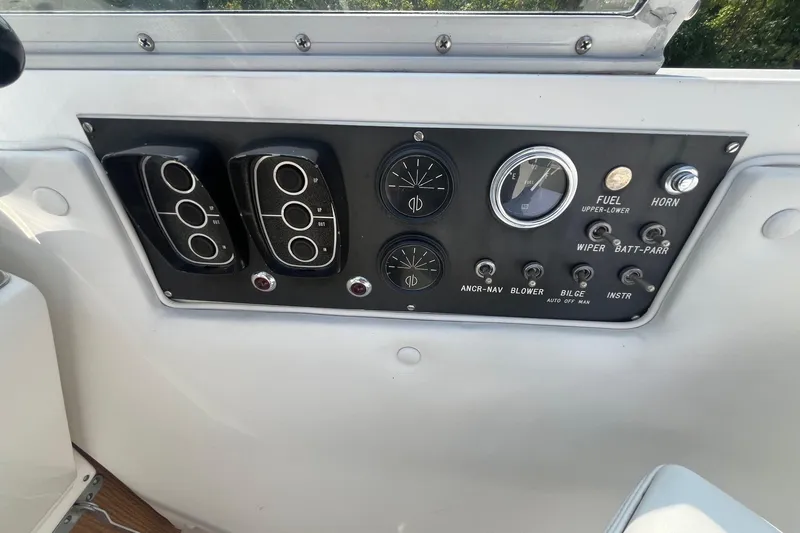 Slide: The Image of Control panel of a 1975 Bertram 26 Moppie boat with gauges and switches. - 17