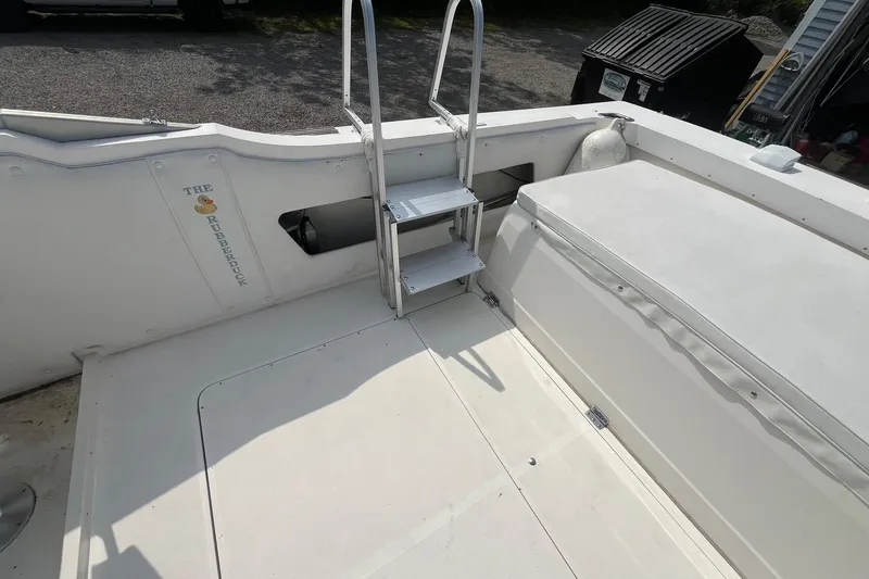 Slide: The Image of 1975 Bertram 26 Moppie boat interior with ladder and seating area. - 22